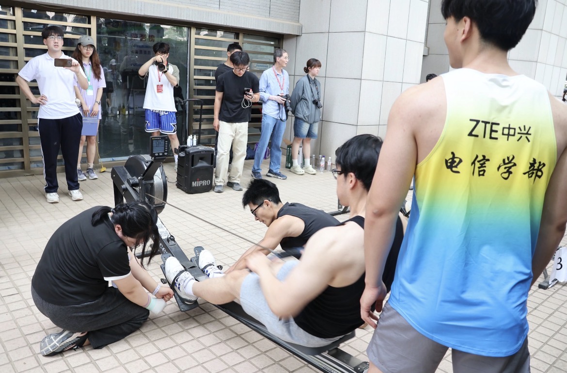 A rowing ergometer race in progress.